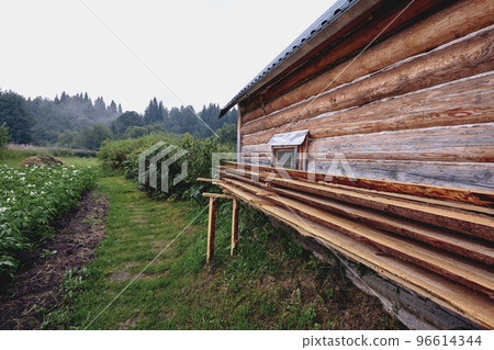 Front view of wooden house in russian village in sunny summer day 96614344