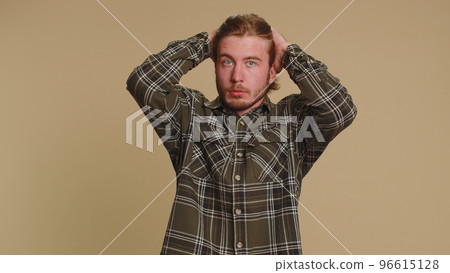 Scared fearful depressed man expresses his fear and waves his hands away from danger, waving no Scared fearful depressed man expresses his fear and waves his hands away from danger, waving no 96615128