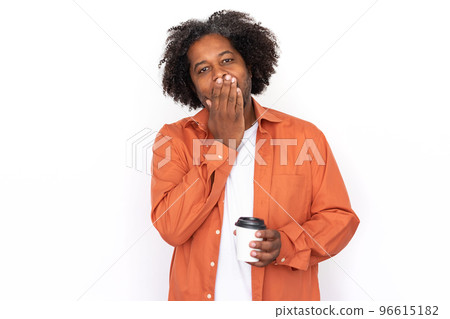 Portrait of surprised mid adult man covering mouth 96615182