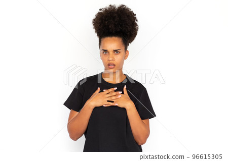 Portrait of frowning young woman looking at camera Portrait of frowning young woman looking at camera 96615305