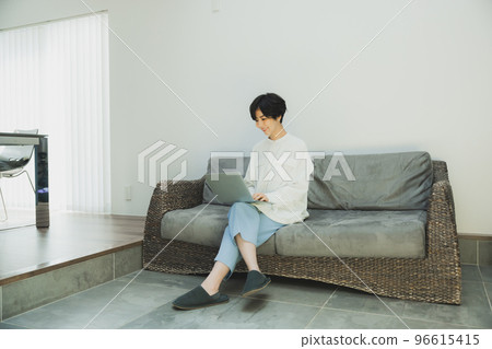 A woman looking at a computer 96615415