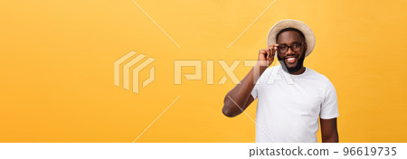 Close up portrait of young afro american shocked tourist , holding his eyewear, wearing tourist outfit, hat, with wide open eyes 96619735