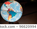 A globe floating in the darkness of a Japanese-style room 96620994