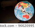 A globe floating in the darkness of a Japanese-style room 96620995
