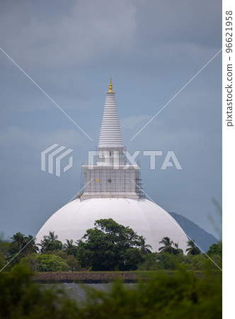 View of Ruwanweli Maha Seya, the Great Thupa over the lake from the distance. View of Ruwanweli Maha Seya, the Great Thupa over the lake from the distance. 96621958