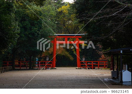 Autumn in the ancient capital of Kyoto World heritage Shimogamo shrine with rain and autumn leaves South entrance torii 96623145