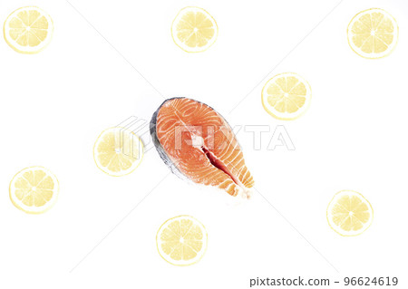 Salmon, slice of fresh raw fish together with lemon slices, isolated on white background 96624619