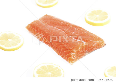 Salmon, fresh raw fish fillet with lemon slices, isolated on white background Salmon, fresh raw fish fillet with lemon slices, isolated on white background 96624620
