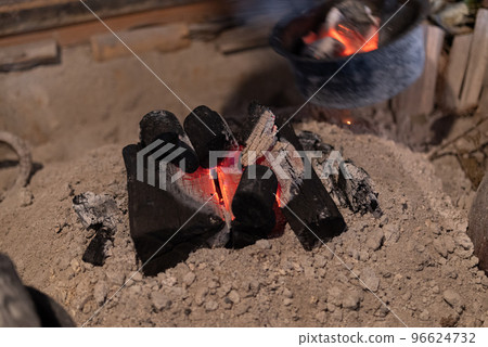 Charcoal fire in the hearth Charcoal fire in the hearth 96624732