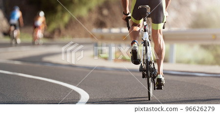 Cycling competition, cyclist athletes riding a race at high speed Cycling competition, cyclist athletes riding a race at high speed 96626279