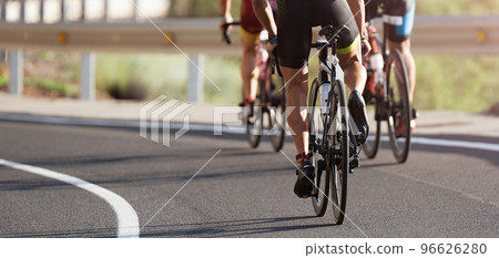 Cycling competition, cyclist athletes riding a race at high speed 96626280