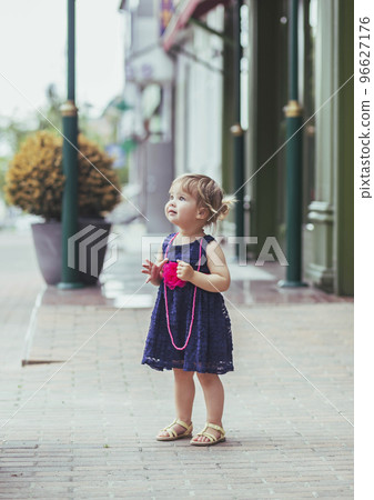 beautiful baby girl in dress on the street beautiful baby girl in dress on the street 96627176