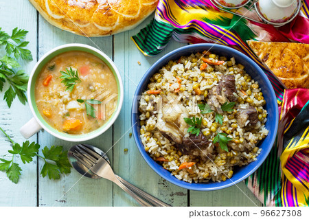Eastern cuisine. Homemade Soup with bean mung and rice with bean mung and beef. Top view flat lay background. Eastern cuisine. Homemade Soup with bean mung and rice with bean mung and beef. Top view flat lay background. 96627308