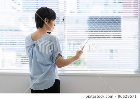 Woman using a smartphone Woman using a smartphone 96628671