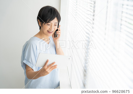 Woman using a smartphone Woman using a smartphone 96628675