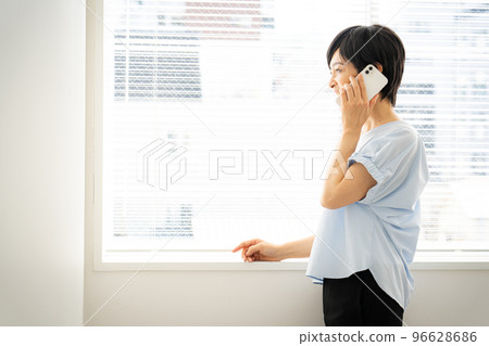 Woman using a smartphone Woman using a smartphone 96628686