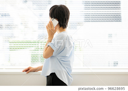 Woman using a smartphone Woman using a smartphone 96628695