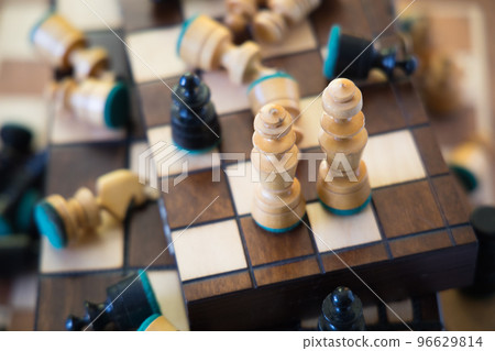 White king and queen among lying chess pieces White king and queen among lying chess pieces 96629814