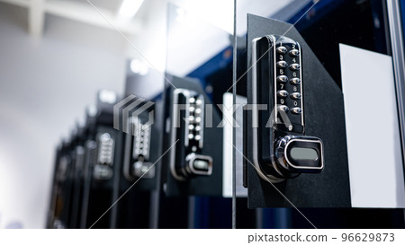 Modern black numeric pad on public locker 96629873