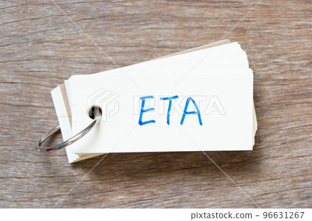 Flash card with handwriting in word ETA (abbreviation of estimated time of arrival) on wood background Flash card with handwriting in word ETA (abbreviation of estimated time of arrival) on wood background 96631267