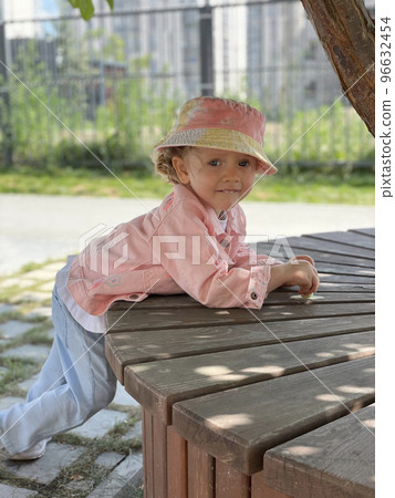 Baby girl in pin clothes and a hat 96632454