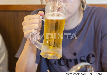 Mouth of a woman drinking beer 96632666