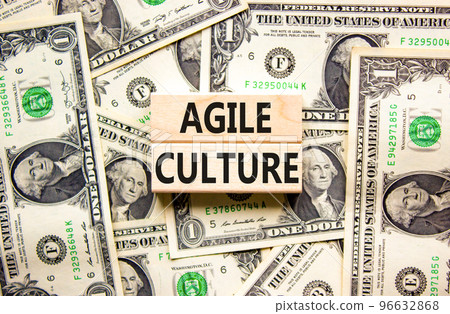 Agile culture symbol. Concept words Agile culture on wooden blocks. Beautiful background from dollar bills. Dollar bills. Business flexible and agile culture concept. Copy space. 96632868
