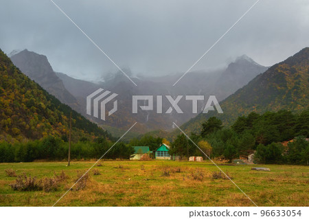 Soft focus. Dramatic view of amazing mountain  village in North Ossetia. Awesome highland scenery with beautiful glacial rainy hills and rocks. Digoria. Caucasus Mountains. 96633054