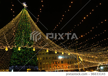 Christmas tree glows on the square in the city. Evening, night illumination 96633143