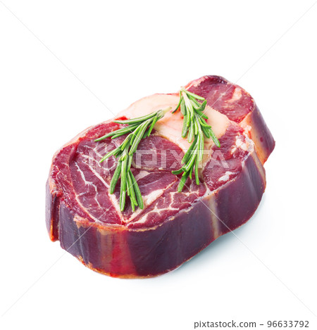 raw beef steak with rosemary isolated on white raw beef steak with rosemary isolated on white 96633792