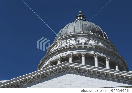 The architecture of buildings windows, stucco molding, and columns on a sunny day in the USA The architecture of buildings windows, stucco molding, and columns on a sunny day in the USA 96634606