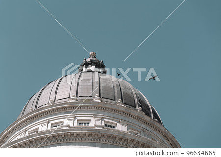 The architecture of buildings windows, stucco molding, and columns on a sunny day in the USA 96634665