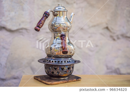 Teapot with tea. Turkish tea concept. Travel in Turkey. Go Everywhere Teapot with tea. Turkish tea concept. Travel in Turkey. Go Everywhere 96634820