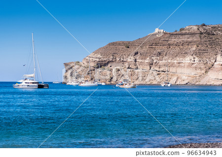 Boat on the aegean sea near Santorini island shore 96634943