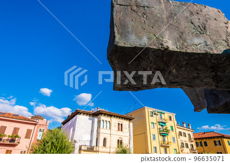 Buildings of Verona behind a black rock 96635071