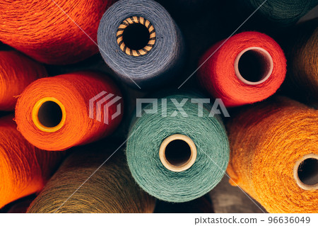 Composition of colorful vibrant wool threads from above. 96636049