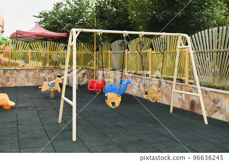 Various Children's toys on the playground. Swing carousel in the park for children. 96636245
