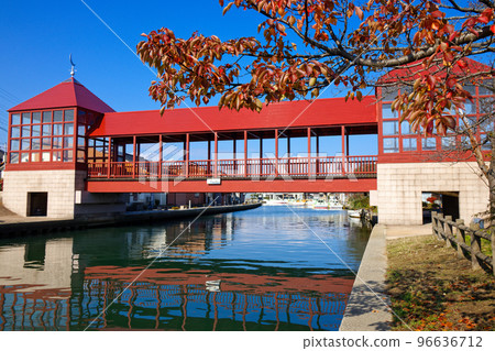 Red bridge Higashibashi and autumn leaves River station Shinminato 96636712