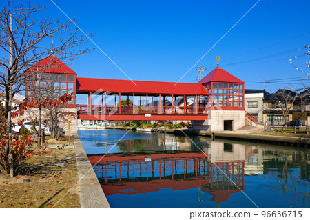 Red bridge Higashibashi and autumn leaves River station Shinminato 96636715