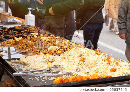 Mussels, shrimp and other seafood on street market, takeaway. Fast or street food concept. Festival of Mediterranean Cuisine. 96637543
