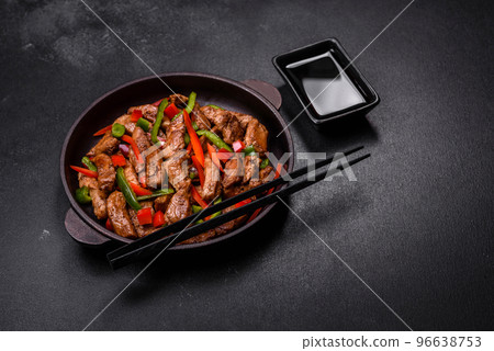 Delicious Asian teriyaki meat with red and green bell peppers 96638753
