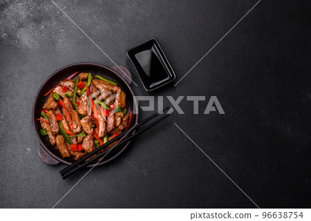 Delicious Asian teriyaki meat with red and green bell peppers 96638754