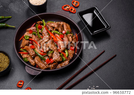 Delicious Asian teriyaki meat with red and green bell peppers Delicious Asian teriyaki meat with red and green bell peppers 96638772