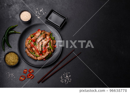 Delicious Asian teriyaki meat with red and green bell peppers 96638778