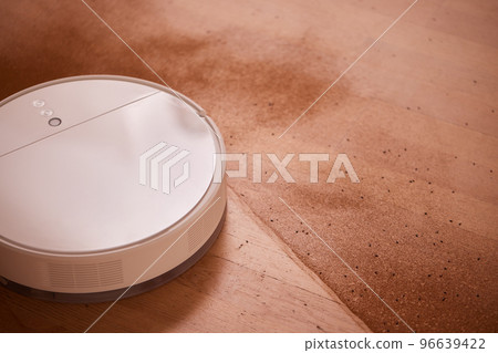 Robot vacuum cleaner cleans the very dirty dusty floor of the apartment at a certain time. Robot vacuum cleaner cleans the very dirty dusty floor of the apartment at a certain time. 96639422