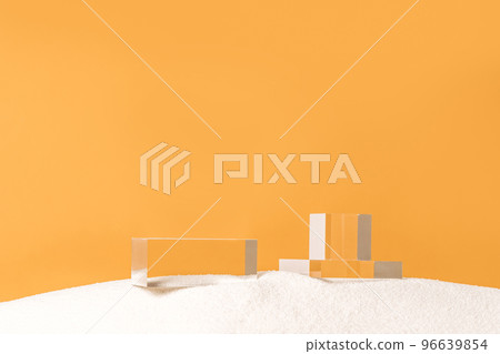 Transparent glass podiums on a white sand. Crystal stage for fashion showcase, product presentation and advertisement. Front view, copy space. 96639854