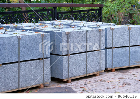 Construction Materials. Building materials for decoration buildings and sidewalk. Granite bricks are sold in construction market. Close up. 96640119