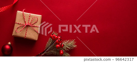 Christmas gifts, boxing day and traditional holiday presents flat lay, classic xmas gift boxes on red background, wrapped present with festive ornaments and decorations for holidays flatlay design 96642317