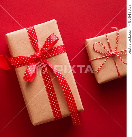 Christmas gifts, boxing day and traditional holiday presents flat lay, classic xmas gift boxes on red background, wrapped present with festive ornaments and decorations for holidays flatlay design 96642318