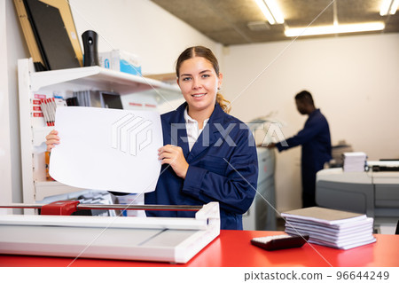 Worker in printing and press centar check print quality 96644249